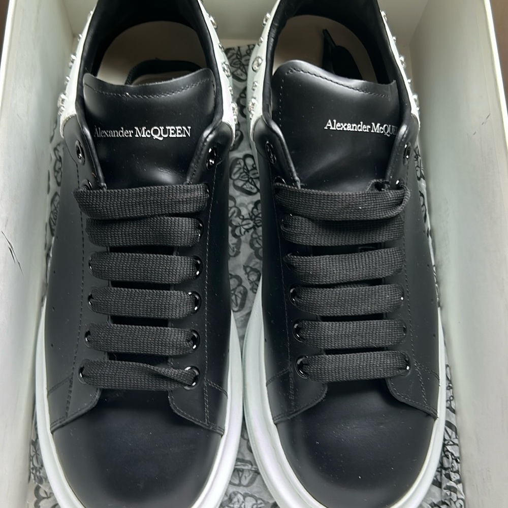 Alexander McQueen’s with a beautiful black and white leather and fat bottom